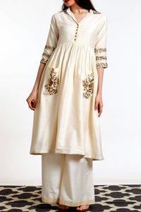 Buy ivory hand embroidered silk blend tunic with matching palazzo online in USA. Get occasion ready with a stunning range of Indian designer dresses from Pure Elegance fashion store in USA. Shop from a collection of designer suits, wedding sarees, wedding lehengas and Indian clothing for a gorgeous ethnic look from our online store.-full view