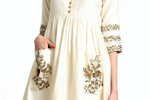 Buy ivory hand embroidered silk blend tunic with matching palazzo online in USA. Get occasion ready with a stunning range of Indian designer dresses from Pure Elegance fashion store in USA. Shop from a collection of designer suits, wedding sarees, wedding lehengas and Indian clothing for a gorgeous ethnic look from our online store.-details