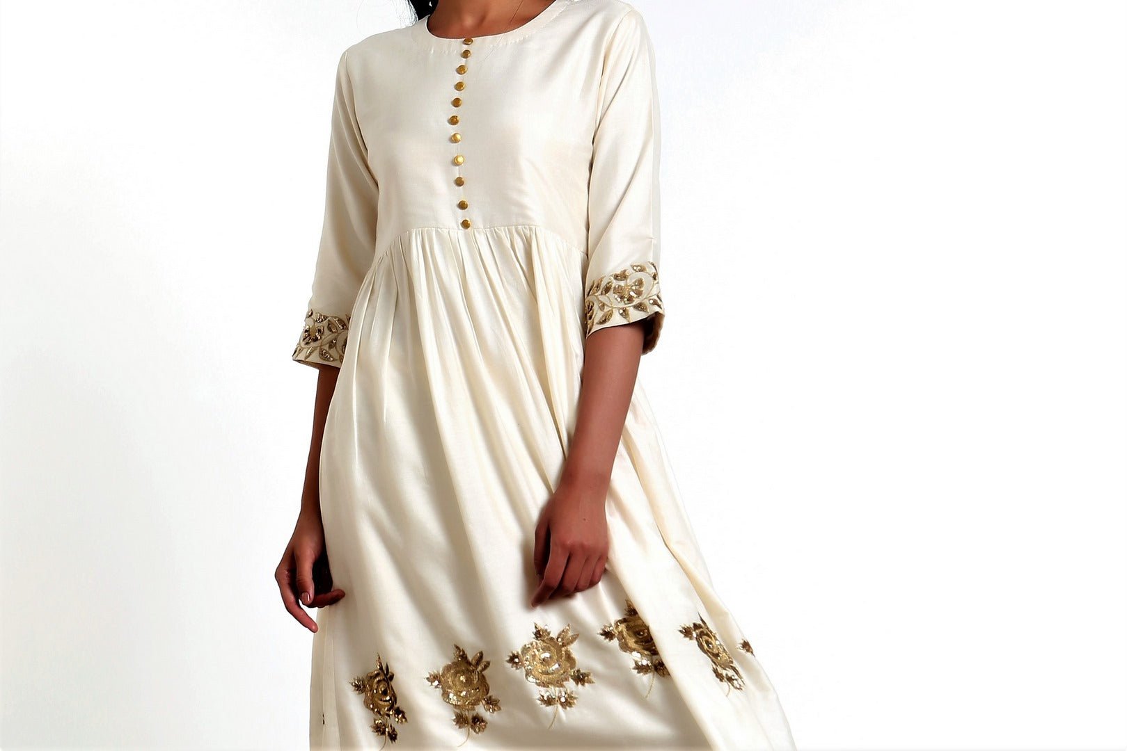 Shop ivory color hand embroidered silk blend tunic with matching palazzo online in USA. Get occasion ready with a stunning range of Indian designer dresses from Pure Elegance fashion store in USA. Shop from a collection of designer suits, wedding lehengas and Indian clothing for a gorgeous ethnic look from our online store.-closeup