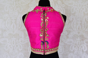 Buy hot pink embroidered sleeveless silk blouse with high neck online in USA. For Indian women in USA, Pure Elegance fashion store brings an alluring collection of readymade saree blouses to match your beautiful Indian sarees. Shop now at our online store.-back