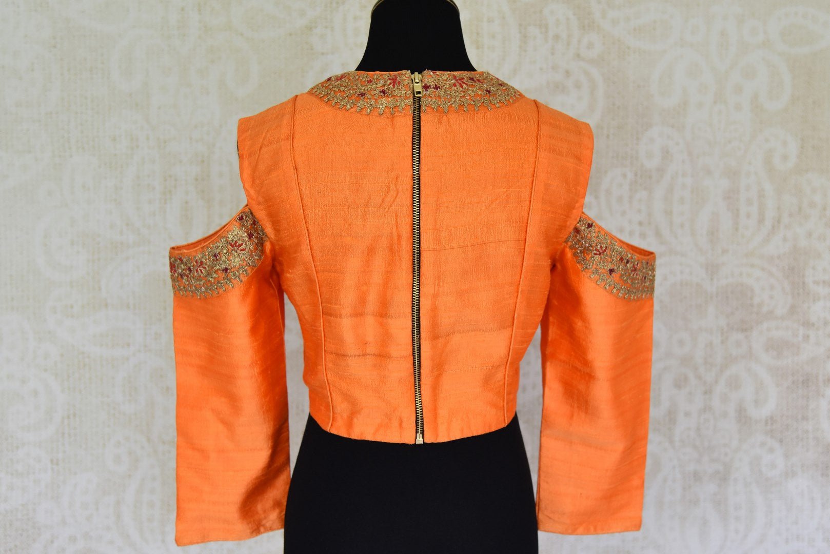 Buy orange color embroidered cold shoulder silk blouse online in USA. For Indian women in USA, Pure Elegance fashion store brings an alluring collection of readymade saree blouses to match your beautiful Indian sarees. Shop now at our online store.-back