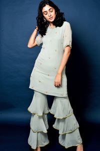 Buy sage green short kurta with layered sharara online in USA and dupatta. Elevate your ethnic style with a stunning range of Indian dresses from Pure Elegance Indian fashion store in USA. You can also shop the same collection from our online store.-full view