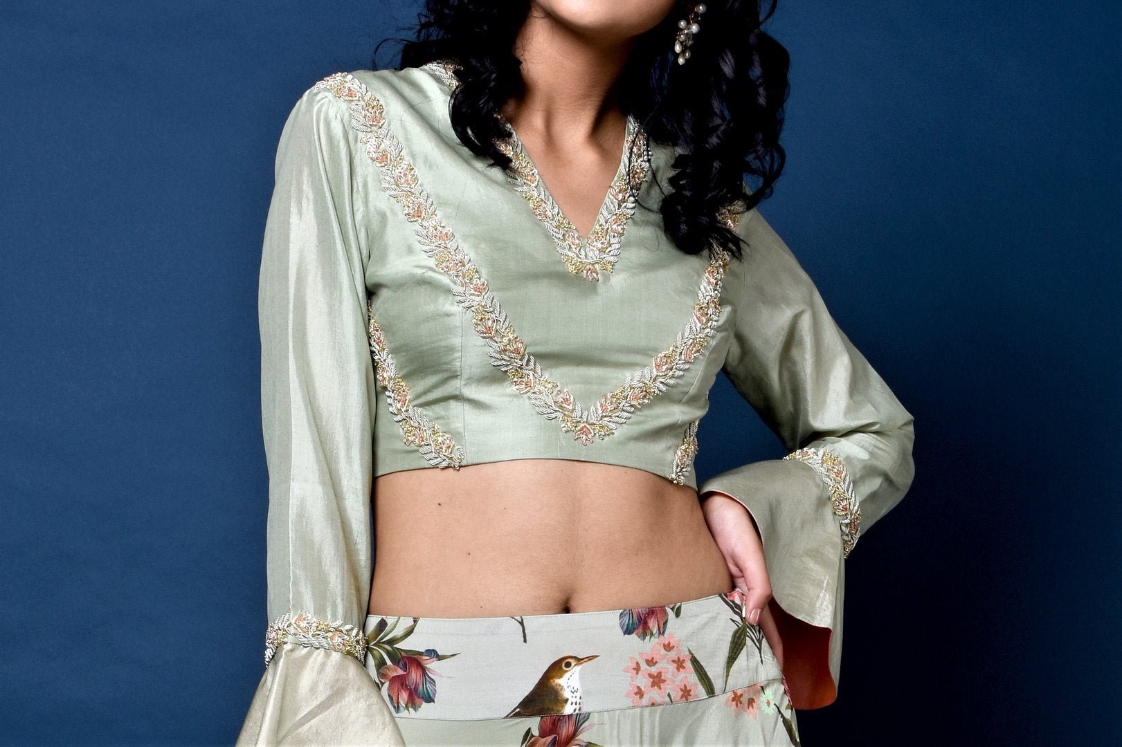 Shop sage green silk top with floral print flared skirt online in USA. Elevate your ethnic style with a stunning range of Indian dresses from Pure Elegance Indian fashion store in USA. You can also shop the same collection from our online store.-blouse