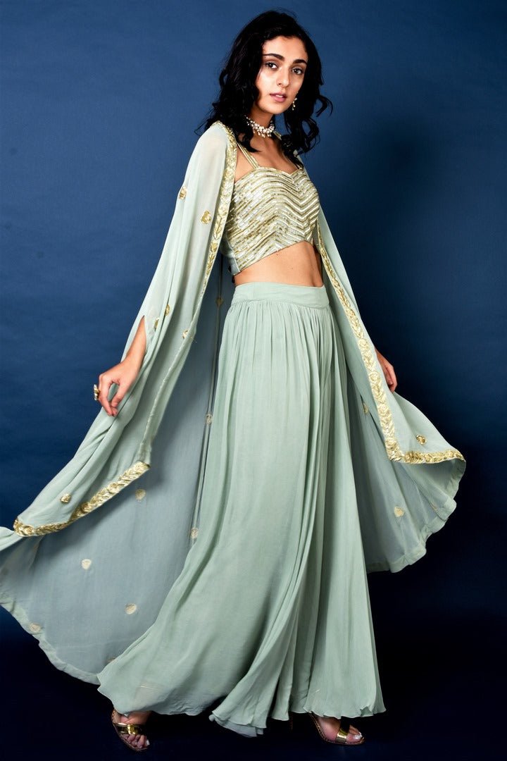 Shop sage green flared pants with embroidered blouse and cape online in USA. Elevate your ethnic style with a stunning range of Indian designer dresses from Pure Elegance Indian fashion store in USA. You can also shop the same collection from our online store.-side