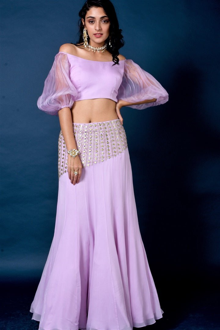 Buy lavender color organza top with mirror work skirt online in USA. Elevate your style with a stunning range of designer dresses, designer gowns, designer Anarkali suits from Pure Elegance Indian fashion store in USA. You can also shop the same collection from our online store.-full view