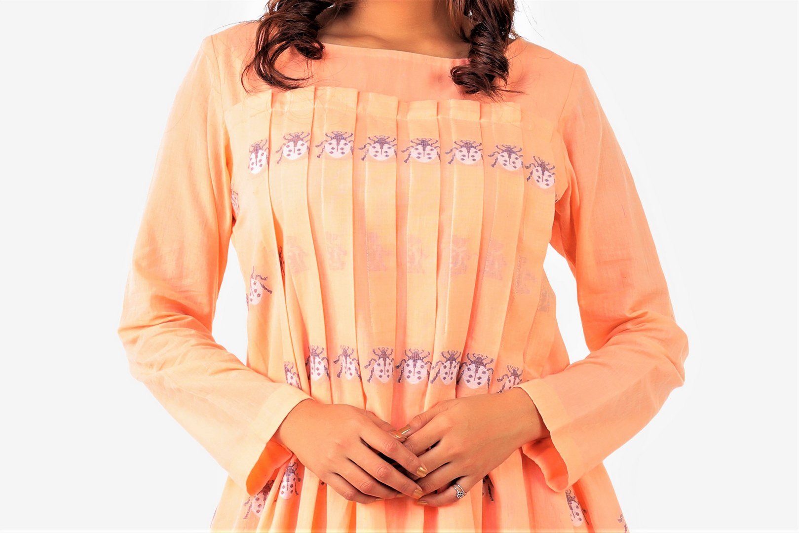 Shop tangerine color jamdani cotton dress with front pleats online in USA. Keep your everyday style chic and up to date with a stylish range of Indian designer dresses from Pure Elegance fashion store in USA.-front