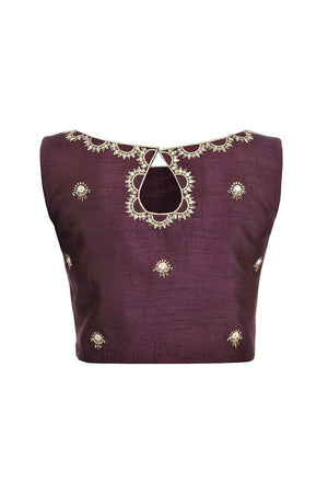 Buy purple sleeveless sari blouse with embroidery online in USA at Pure Elegance fashion store. Choose from a range of exquisite readymade designer sari blouses perfect to amp up your saree style. also available at our online store.-back