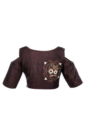 Buy burgundy color raw silk embroidered saree blouse with cold shoulder sleeves online in USA from Pure Elegance fashion store. Choose from a range of exquisite readymade designer sari blouses perfect to amp up your saree style. also available at our online store.-back