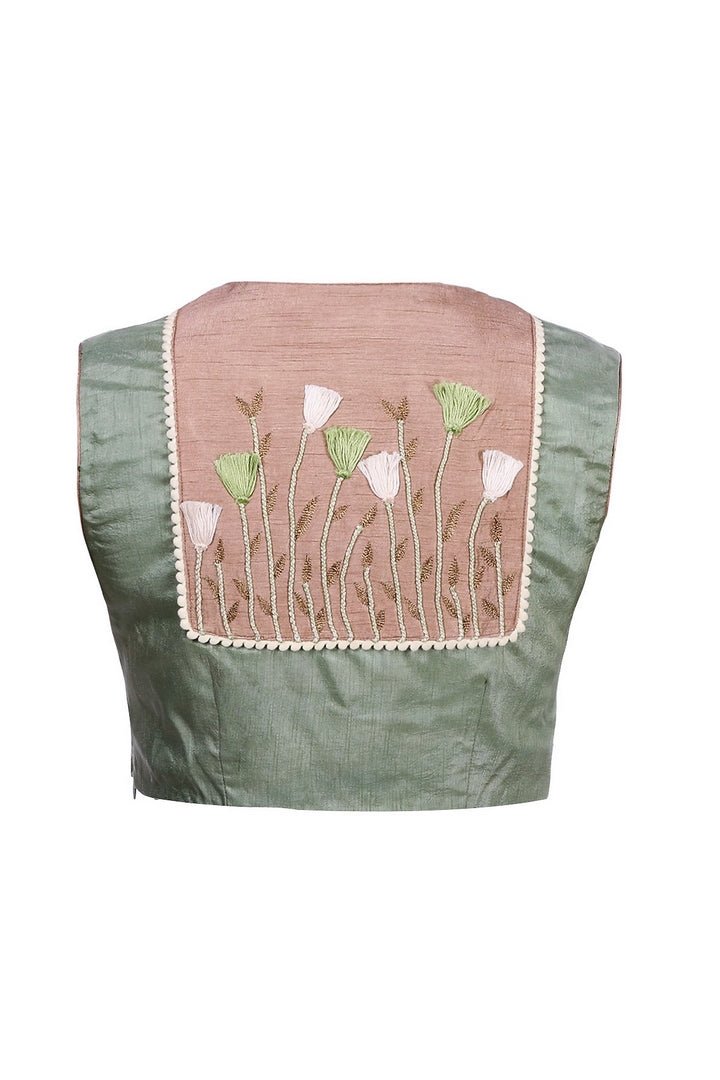 Shop pista green embroidered sleeveless raw silk saree blouse online in USA from Pure Elegance fashion store. Choose from a range of exquisite readymade designer sari blouses perfect to amp up your saree style. also available at our online store.-back