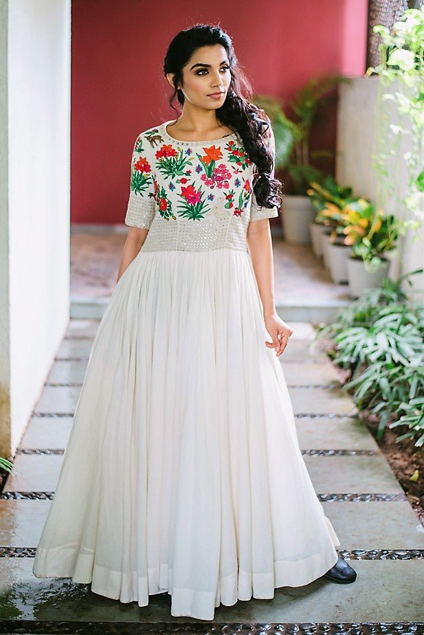 Buy off-white hand embroidered full length gathered dress online in USA. Pick your favorite Indian dresses from Pure Elegance clothing store in USA. Step up your style with a range of Indian designer dresses, suits, designer lehengas also available on our online store.-full view