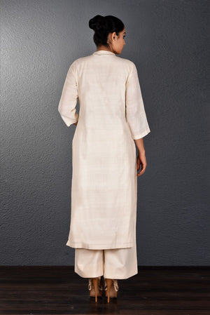 Buy off-white embroidered kurta with straight pants online in USA. Pick your favorite Indian dresses from Pure Elegance clothing store in USA. Step up your style with a range of Indian designer dresses, suits, designer lehengas also available on our online store. -back