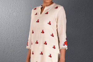 Buy off-white Parsi embroidery kurta with straight pants online in USA. Pick your favorite Indian dresses from Pure Elegance clothing store in USA. Step up your style with a range of Indian designer dresses, suits, designer lehengas also available on our online store. -top
