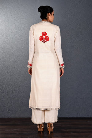 Buy off-white aari and mirror work kurta with straight pants online in USA. Pick your favorite Indian dresses from Pure Elegance clothing store in USA. Step up your style with a range of Indian designer dresses, suits, designer lehengas also available on our online store. -back