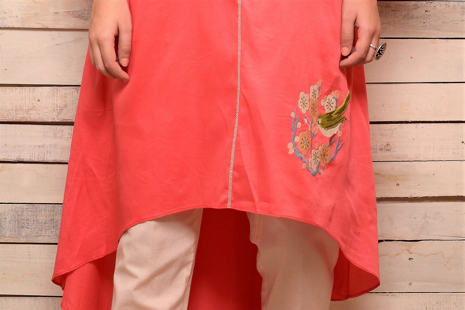 Buy tomato red embroidered cotton shirt with beige pants online in USA. Pick your favorite Indian designer suits and dresses from Pure Elegance clothing store in USA. Make your ethnic collection complete with a range of Indian saris, Anarkali suits, designer lehengas also available on our online store.  -bottom