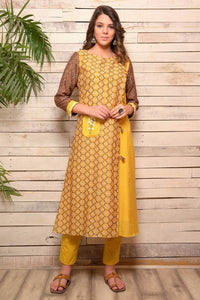Buy yellow Angrakha style cotton silk kurta with matching pants online in USA. Pick your favorite Indian designer suits and dresses from Pure Elegance clothing store in USA. Make your ethnic collection complete with a range of Indian saris, Anarkali suits, designer lehengas also available on our online store.  -full view