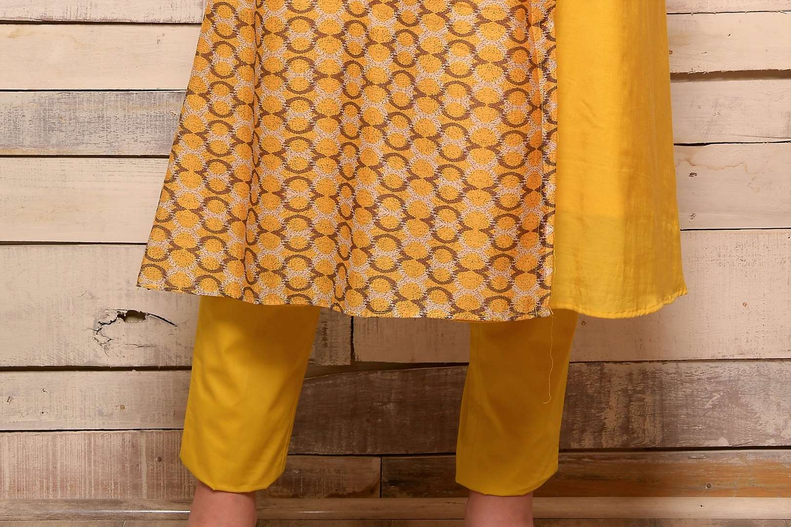 Buy yellow Angrakha style cotton silk kurta with matching pants online in USA. Pick your favorite Indian designer suits and dresses from Pure Elegance clothing store in USA. Make your ethnic collection complete with a range of Indian saris, Anarkali suits, designer lehengas also available on our online store.  -bottom
