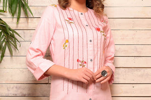 Shop pink embroidered cotton kurta with grey pants online in USA. Pick your favorite Indian designer suits and dresses from Pure Elegance clothing store in USA. Make your ethnic collection complete with a range of Indian sarees, Anarkali suits, designer lehengas also available on our online store.  -top