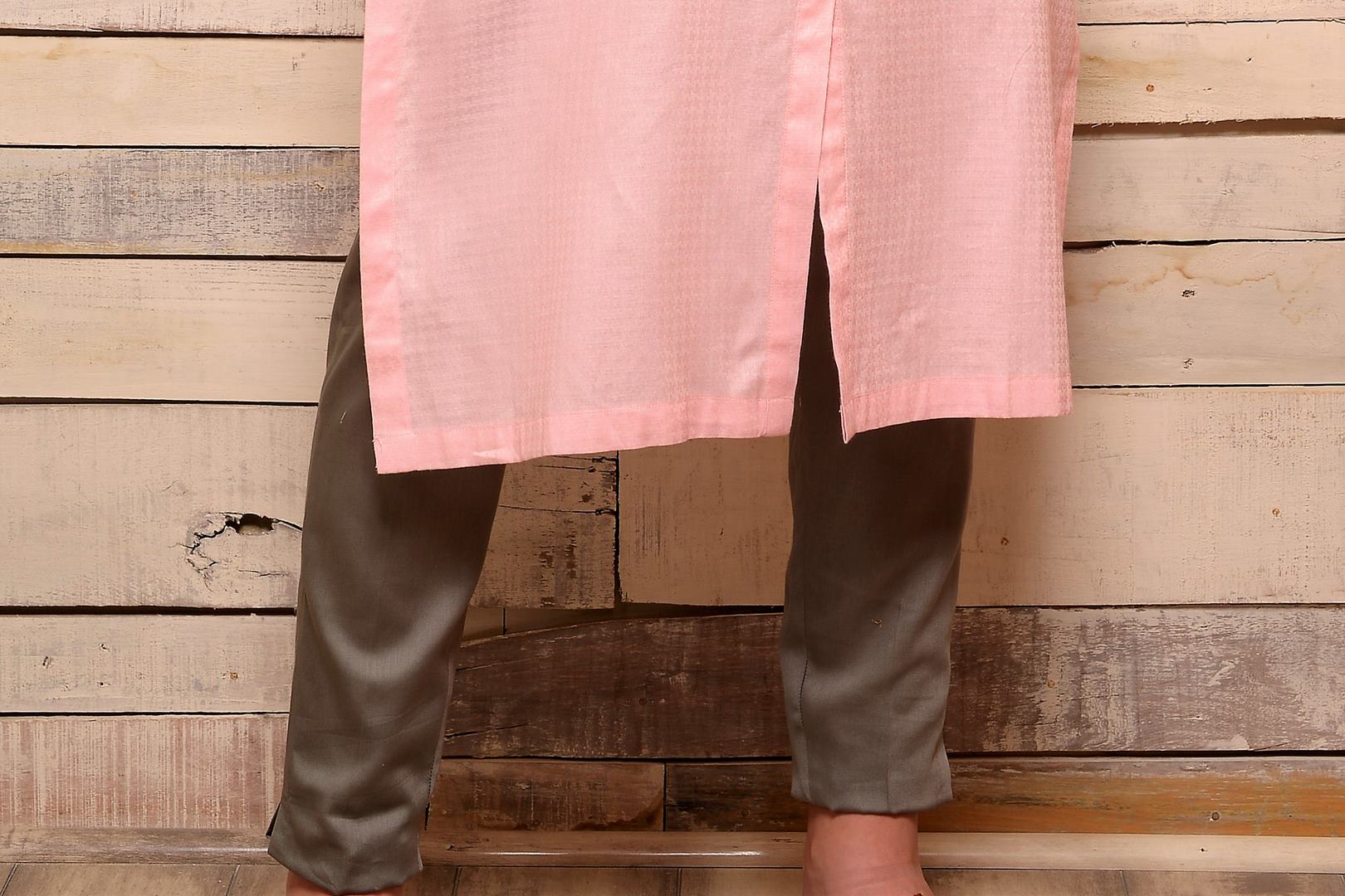 Shop pink embroidered cotton kurta with grey pants online in USA. Pick your favorite Indian designer suits and dresses from Pure Elegance clothing store in USA. Make your ethnic collection complete with a range of Indian sarees, Anarkali suits, designer lehengas also available on our online store.  -bottom
