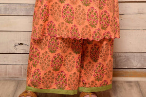 Buy peach printed cotton kurta with palazzo online in USA and green embroidered scarf. Pick your favorite Indian designer suits and dresses from Pure Elegance clothing store in USA. Make your ethnic collection complete with a range of Indian sarees, Anarkali suits, designer lehengas also available on our online store.  -bottom