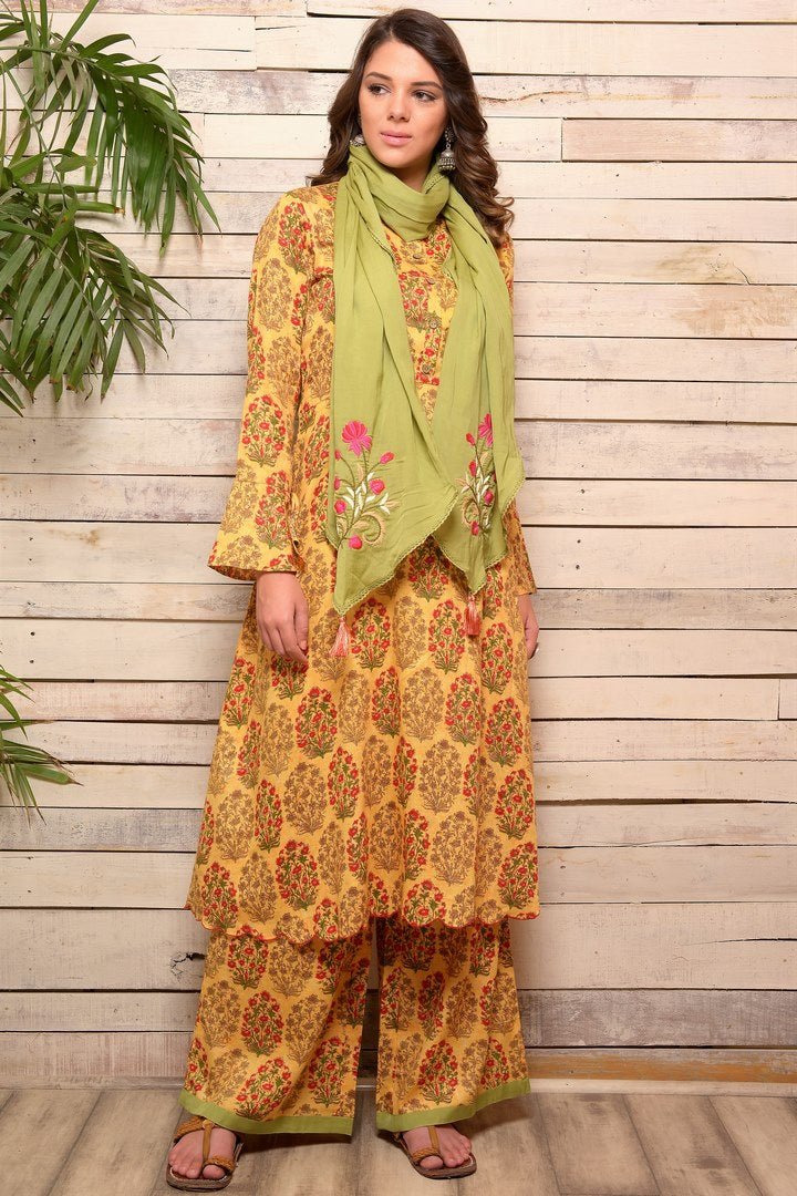 Shop yellow printed cotton kurta with palazzo online in USA and green embroidered scarf. Pick your favorite Indian designer suits and dresses from Pure Elegance clothing store in USA. Make your ethnic collection complete with a range of Indian sarees, Anarkali suits, designer lehengas also available on our online store.  -full view