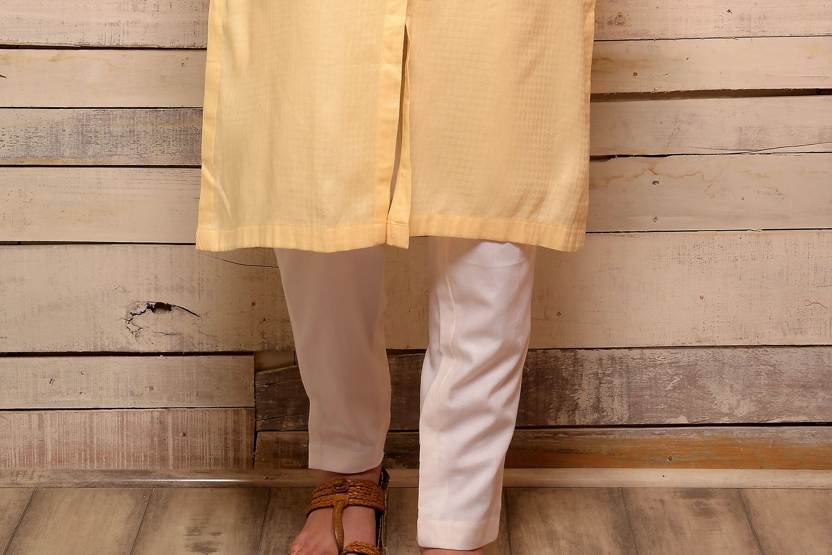 Buy lemon color embroidered kurta with white pants online in USA. Pick your favorite Indian designer suits and dresses from Pure Elegance clothing store in USA. Make your ethnic collection complete with a range of Indian sarees, Anarkali suits, designer lehengas also available on our online store.  -bottom