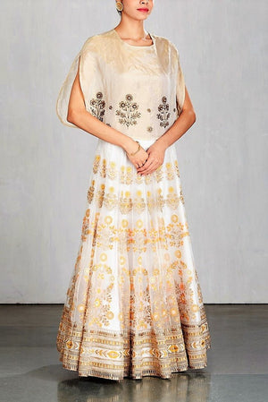Buy ivory color embroidered cape with embroidered skirt online in USA. Make a captivating fashion statement with a range of Indian designer dresses from Pure Elegance clothing store in USA. If you are looking for online shopping, then look to our online store for a stunning collection of designer lehengas, Indian clothing and much more.-side