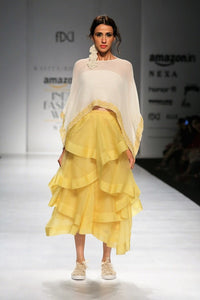Buy off-white embroidered chiffon top with yellow tiered skirt online in USA. Make a captivating fashion statement with a range of designer dresses from Pure Elegance clothing store in USA. If you are looking for Indian designer clothes online, then look to our online store for a stunning collection of Anarkali dresses, wedding lehengas and much more.-full view