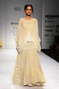 Shop beige ombre poncho with thread embroidery skirt online in USA. Make a captivating fashion statement with a range of designer dresses from Pure Elegance clothing store in USA. If you are looking for Indian designer clothes online, then look to our online store for a stunning collection of Anarkali dresses, wedding lehengas and much more.-full view