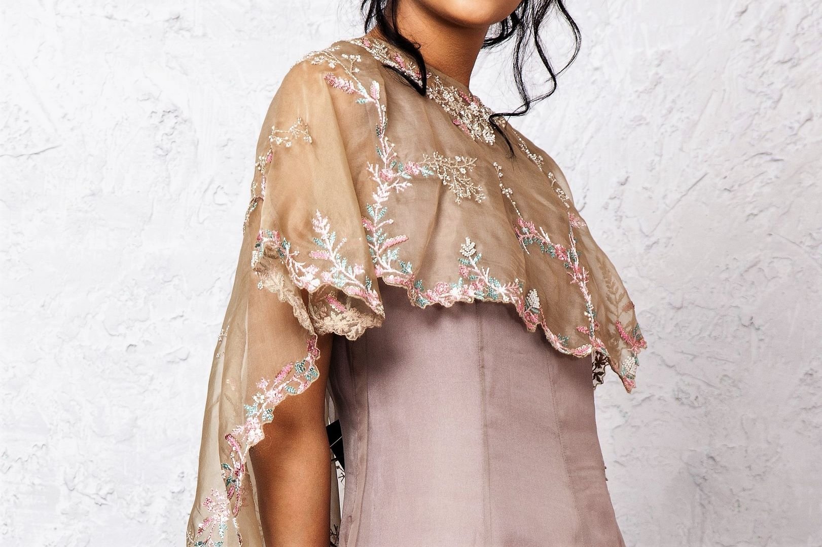 Buy grey embroidered hi-low circular cape & balloon dress online in USA. Keep your style perfect with a stylish range of Indian designer dresses from Pure Elegance fashion store in USA. If you want to shop for modern Indian clothing online, then browse through our online store and shop at the comfort of your home.-cape