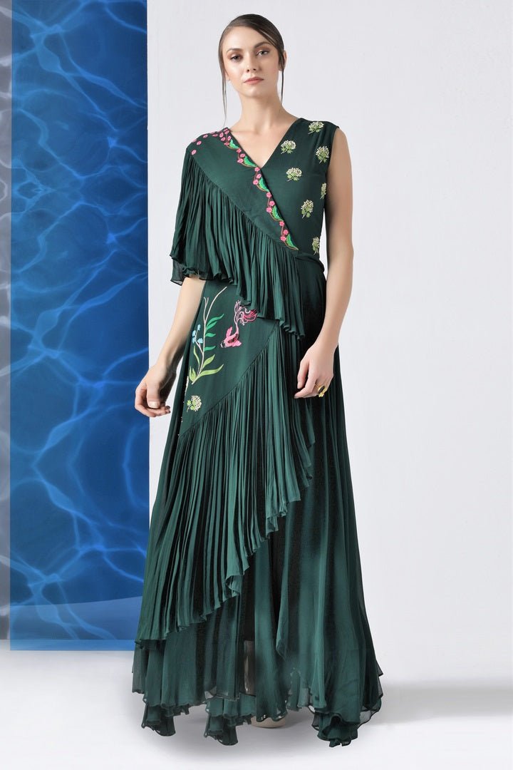 Shop bottle green embroidered layered frills gown online in USA at Pure Elegance. Make your wardrobe an eclectic mix of alluring silhouettes and colors with a range of Indian designer clothes available at our clothing store in USA. -full view