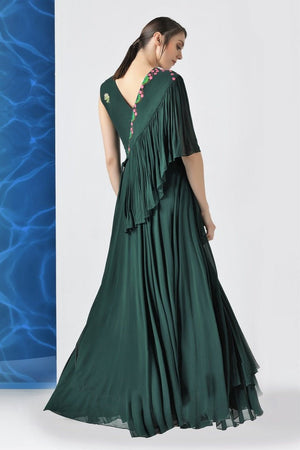 Shop bottle green embroidered layered frills gown online in USA at Pure Elegance. Make your wardrobe an eclectic mix of alluring silhouettes and colors with a range of Indian designer clothes available at our clothing store in USA. -back