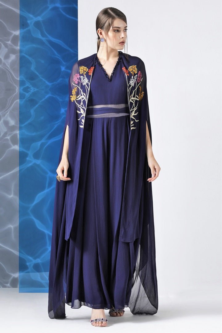 Buy navy embroidered jumpsuit with embroidered cape online in USA from Pure Elegance. Make your wardrobe an eclectic mix of alluring silhouettes and colors with a range of Indian designer clothes available at our clothing store in USA. -front
