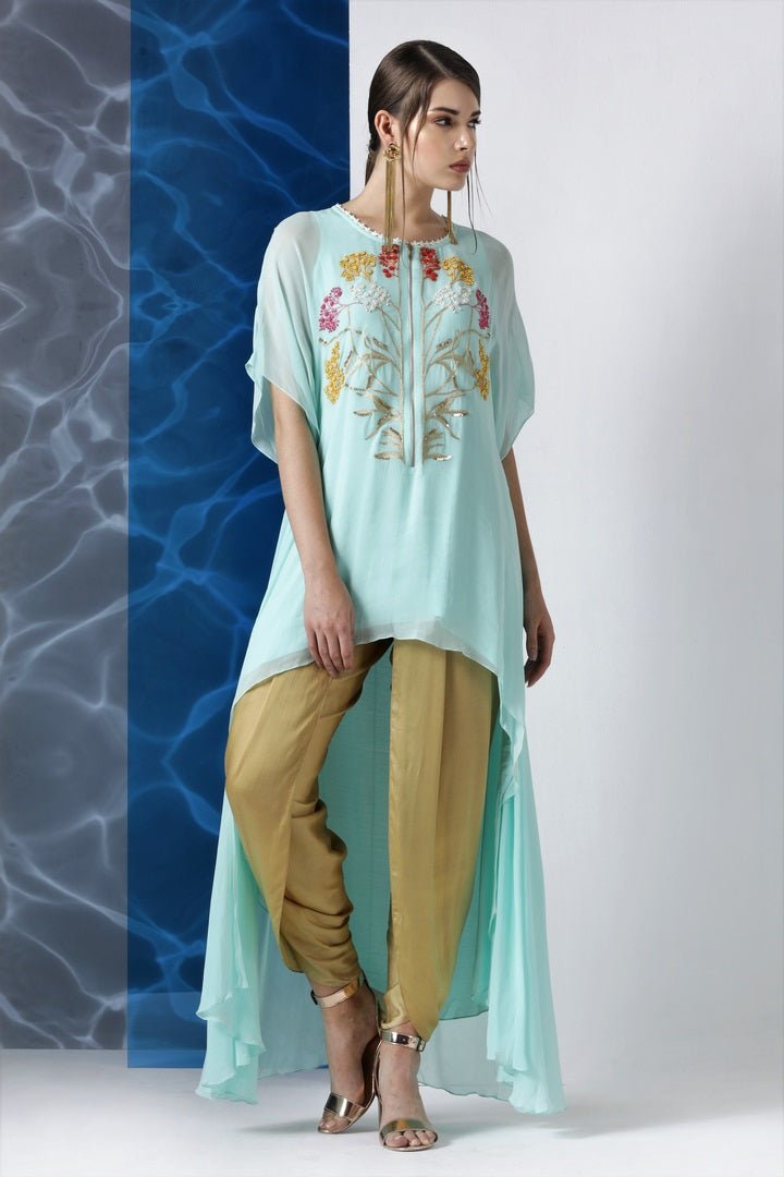 Buy sky blue embroidered asymmetric tunic online in USA from Pure Elegance. Make your wardrobe an eclectic mix of alluring silhouettes and colors with a range of Indian designer clothes available at our clothing store in USA. -front
