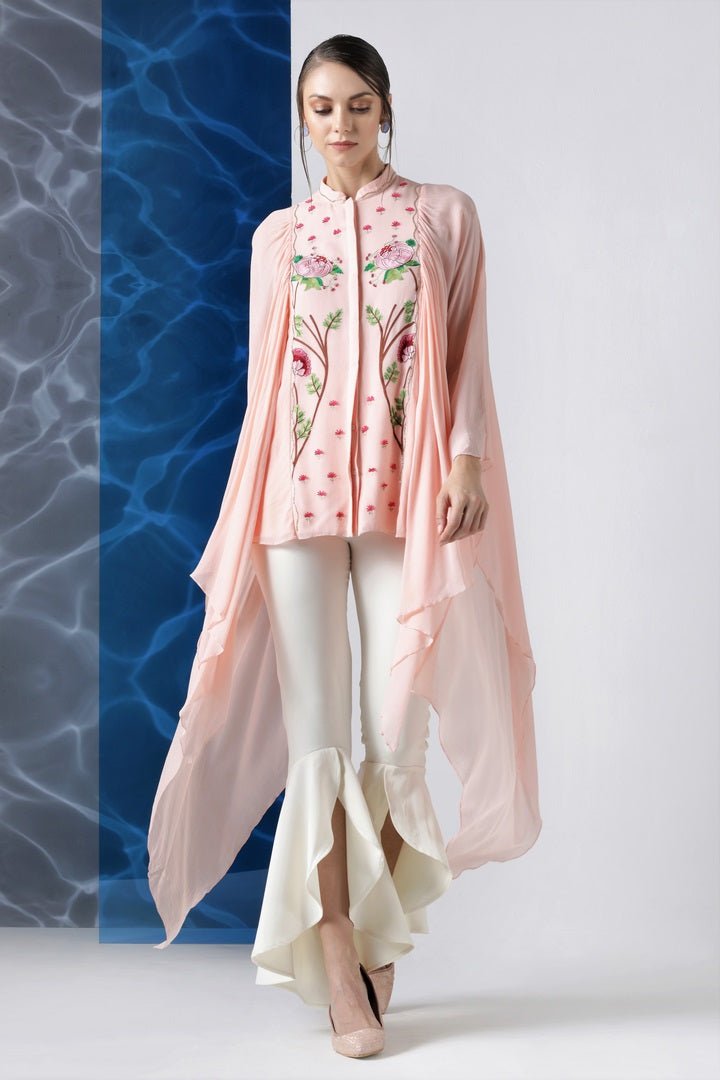 Shop powder pink embroidered top with exaggerated sleeves online in USA at Pure Elegance. Make your wardrobe an eclectic mix of alluring silhouettes and colors with a range of Indian designer clothes available at our clothing store in USA. -full view