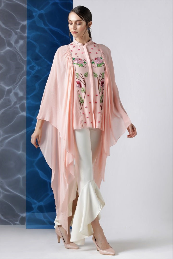 Shop powder pink embroidered top with exaggerated sleeves online in USA at Pure Elegance. Make your wardrobe an eclectic mix of alluring silhouettes and colors with a range of Indian designer clothes available at our clothing store in USA. -side