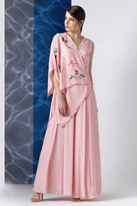 Buy powder pink embroidered jumpsuit with one shoulder drape online in USA at Pure Elegance. Make your wardrobe an eclectic mix of alluring silhouettes and colors with a range of Indian designer clothes available at our clothing store in USA. -full view