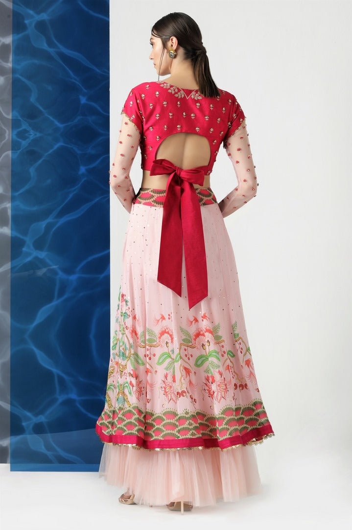Shop red and pink embroidered and printed skirt set online in USA at Pure Elegance. Make your wardrobe an eclectic mix of alluring silhouettes and colors with a range of Indian designer clothing available at our clothing store in USA. -back