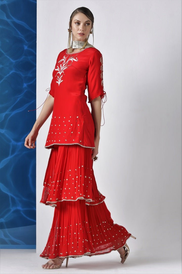 Buy red embroidered kurta with layered kurta with pleated dupatta online in USA from Pure Elegance. Make your wardrobe an eclectic mix of alluring silhouettes and colors with a range of Indian designer clothes available at our clothing store in USA. -side