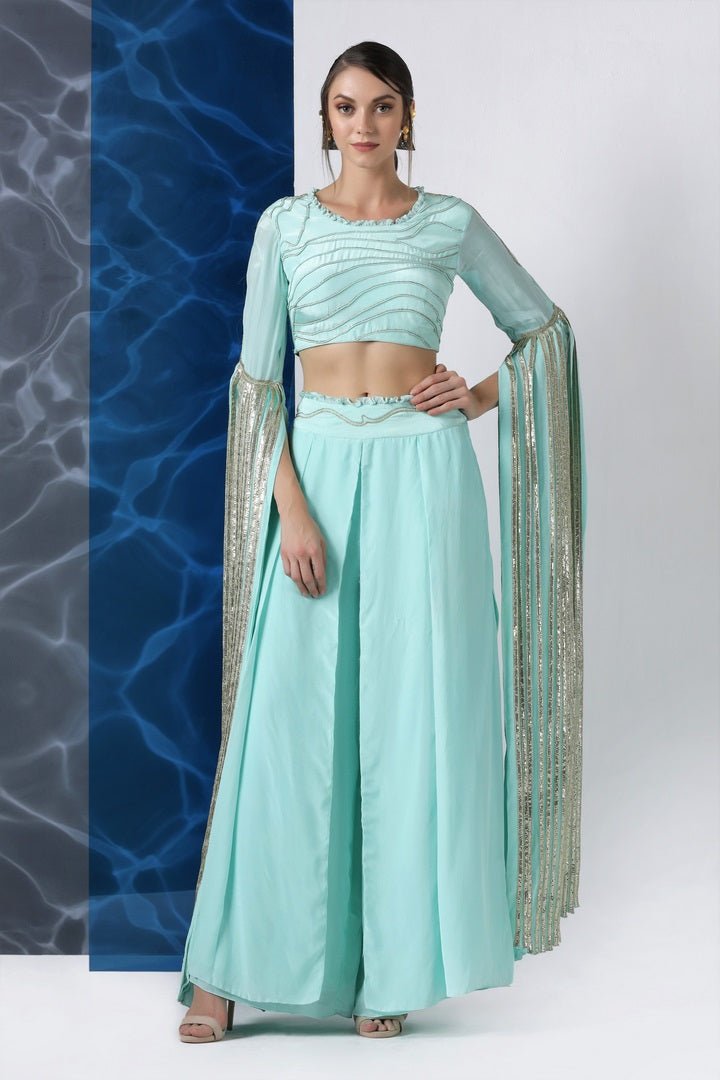 Buy mint embroidered crop top with exaggerated sleeves and palazzo online in USA at Pure Elegance. Make your wardrobe an eclectic mix of alluring silhouettes and colors with a range of Indian designer clothes available at our clothing store in USA. -front
