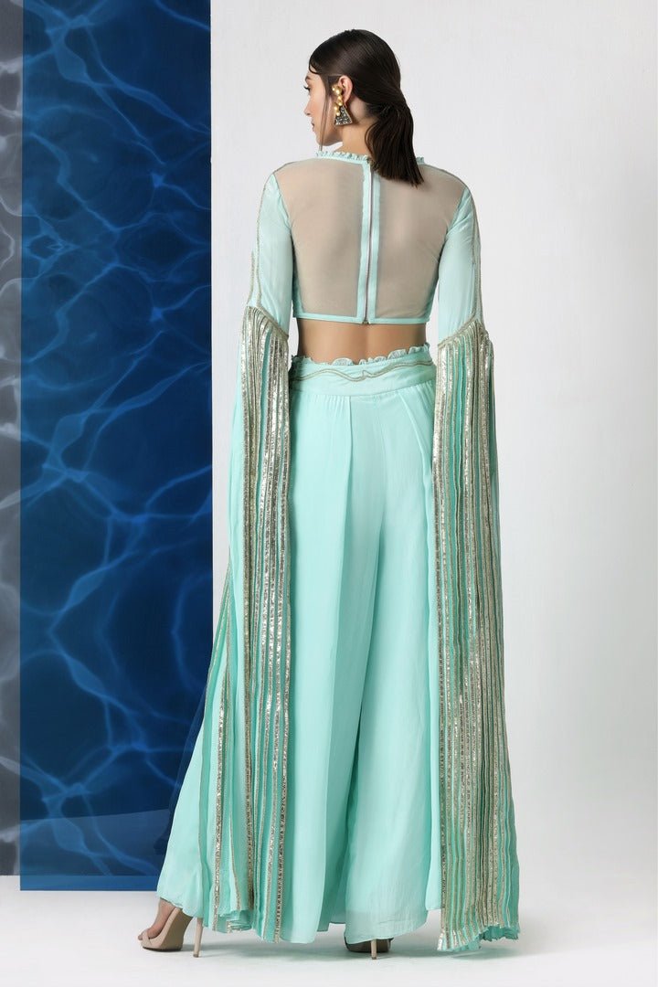 Buy mint embroidered crop top with exaggerated sleeves and palazzo online in USA at Pure Elegance. Make your wardrobe an eclectic mix of alluring silhouettes and colors with a range of Indian designer clothes available at our clothing store in USA. -back