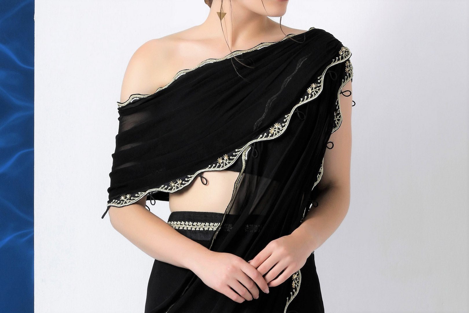 Buy black embroidered crop top with draped dupatta and bell bottoms online in USA from Pure Elegance. Make your wardrobe an eclectic mix of alluring silhouettes and colors with a range of Indian designer clothing available at our clothing store in USA. -crop top