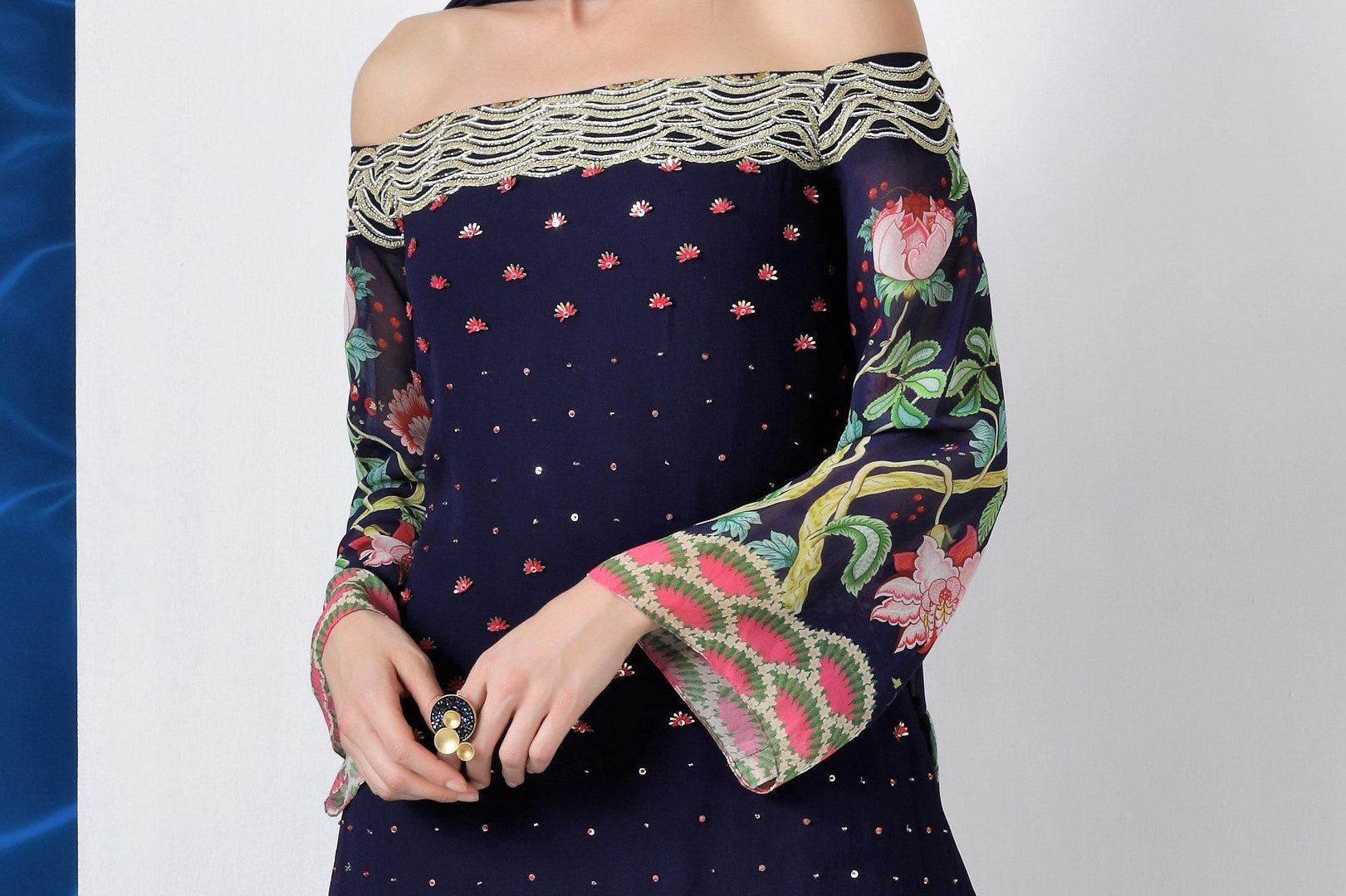 Buy navy embroidered off shoulder kurti with sharara and dupatta online in USA from Pure Elegance. Make your wardrobe an eclectic mix of alluring silhouettes and colors with a range of Indian designer clothing available at our clothing store in USA. -kurti