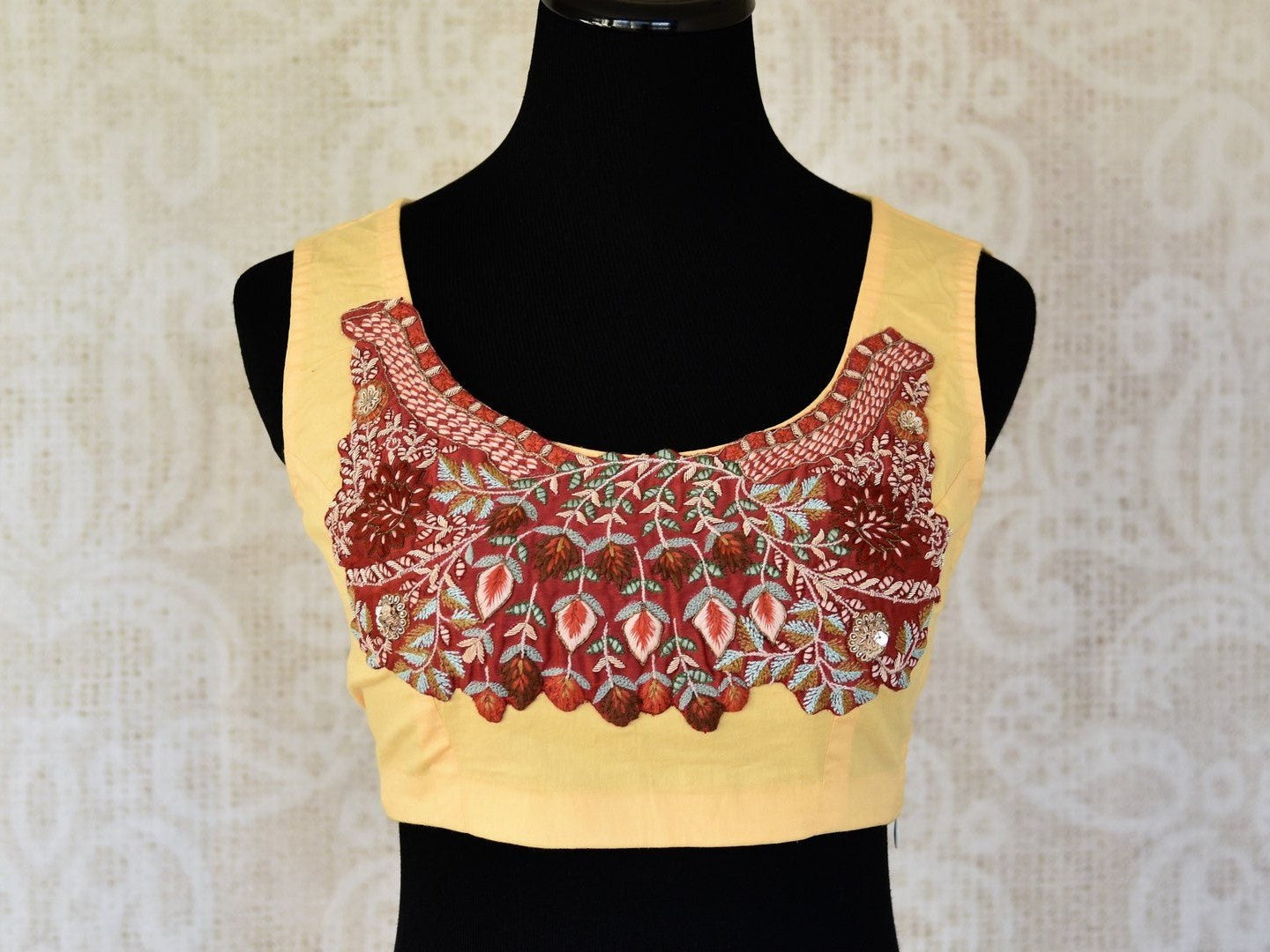 Buy lemon yellow embroidered sleeveless cotton saree blouse online in USA. Elevate your traditional Indian sarees with matching and contrasting designer sari blouses from Pure Elegance Indian clothing store in USA.-front