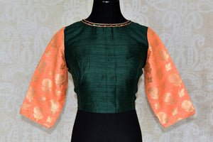 Shop dark green silk saree blouse online in USA with peach Banarasi sleeves. Enhance your ethnic saree look with beautiful Indian designer saree blouses from Pure Elegance Indian fashion store in USA.-front