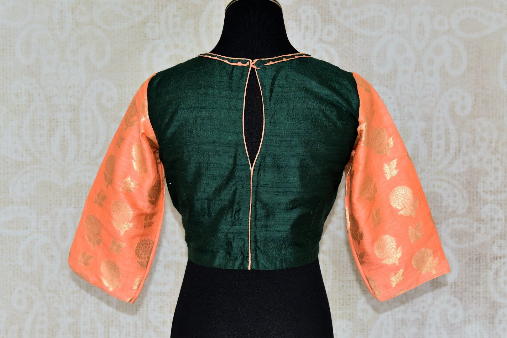 Shop dark green silk saree blouse online in USA with peach Banarasi sleeves. Enhance your ethnic saree look with beautiful Indian designer saree blouses from Pure Elegance Indian fashion store in USA.-back