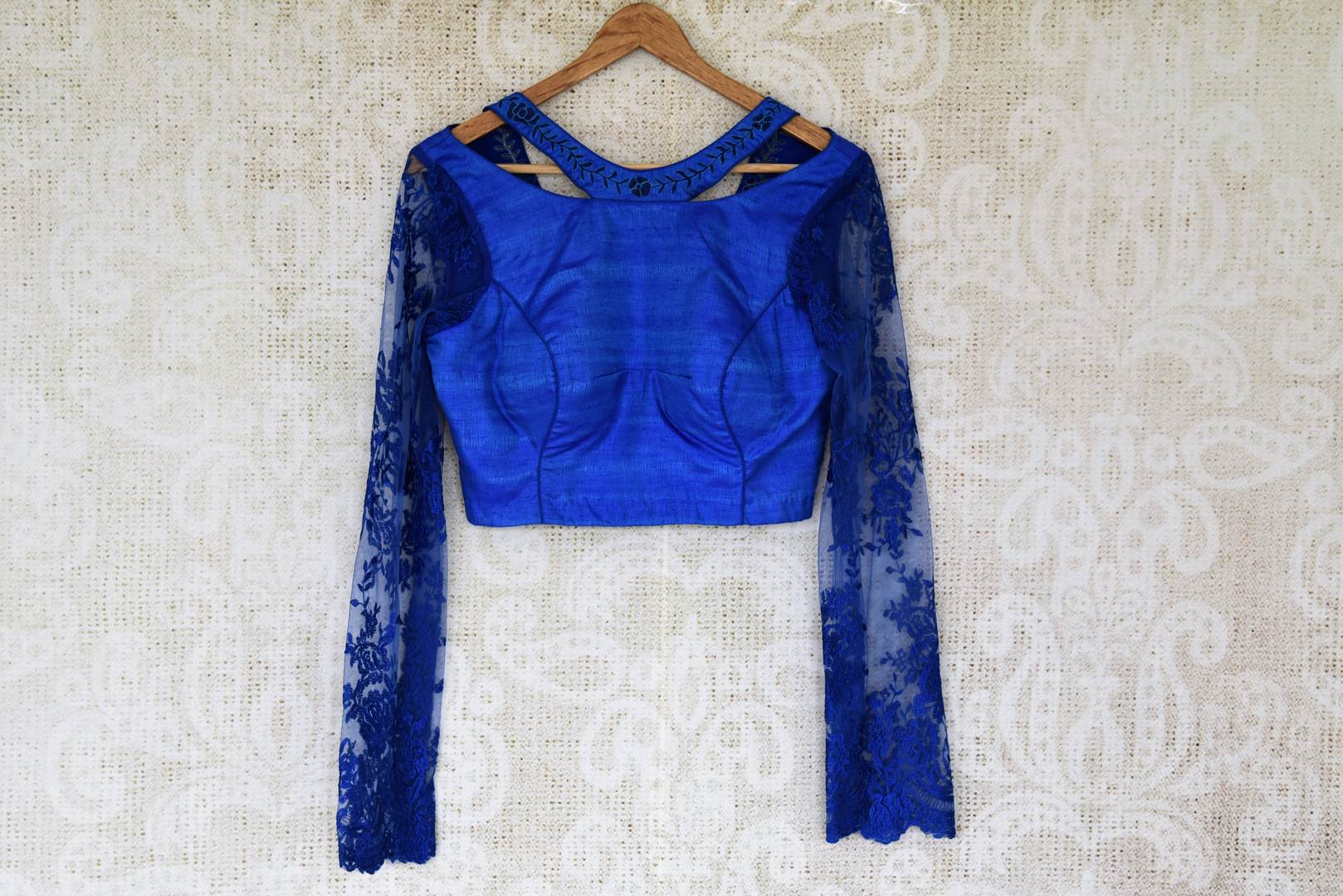 Buy ink blue silk sari blouse online in USA with embroidered net sleeves. Enhance your ethnic saree look with beautiful Indian readymade saree blouses from Pure Elegance Indian fashion store in USA.-front