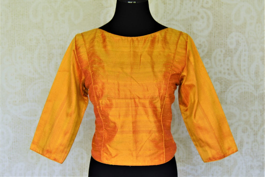 Shop stunning solid yellow koti style silk saree blouse online in USA. Complete your ethnic saree look with designer blouses, readymade sari blouse, embroidered saree blouse from Pure Elegance Indian saree store in USA.-front