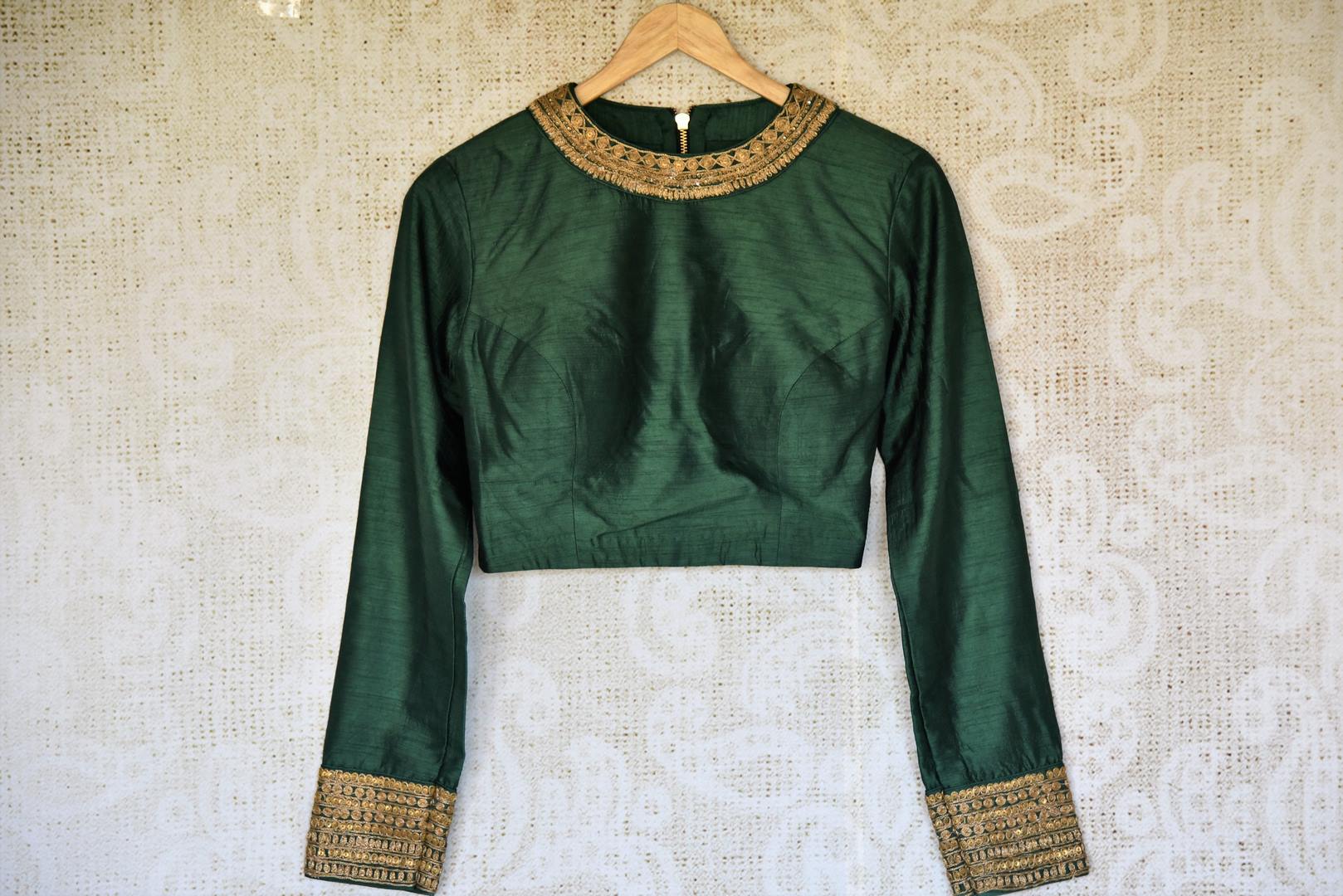 Buy bottle green embroidered silk designer sari blouse with full sleeves online in USA. Complete your saree look with exquisite designer sari blouses from Pure Elegance Indian clothing store in USA. -front