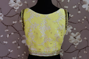 Shop lemon yellow embroidered silk sleeveless saree blouse online in USA. Score a perfect ten for your saree look with exquisite designer saree blouses from Pure Elegance Indian fashion store in USA. Shop now.-back