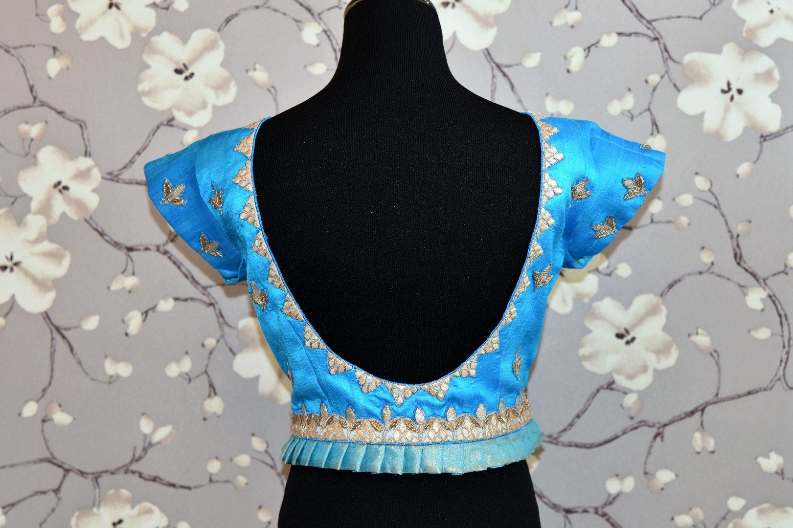 Shop turquoise blue embroidered raw silk saree blouse online in USA. Enhance your traditional saree look with a splendid range of designer saree blouses from Pure Elegance Indian fashion store in USA.-back